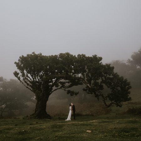 A bride and groom in Fanal forest, one of the best Elopement photo locations in Madeira