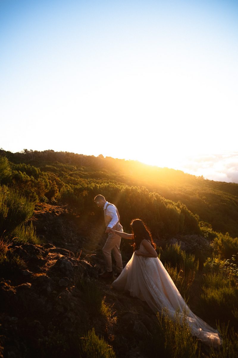 A bridal couple at sunrise on the morning of their Madeira elopement