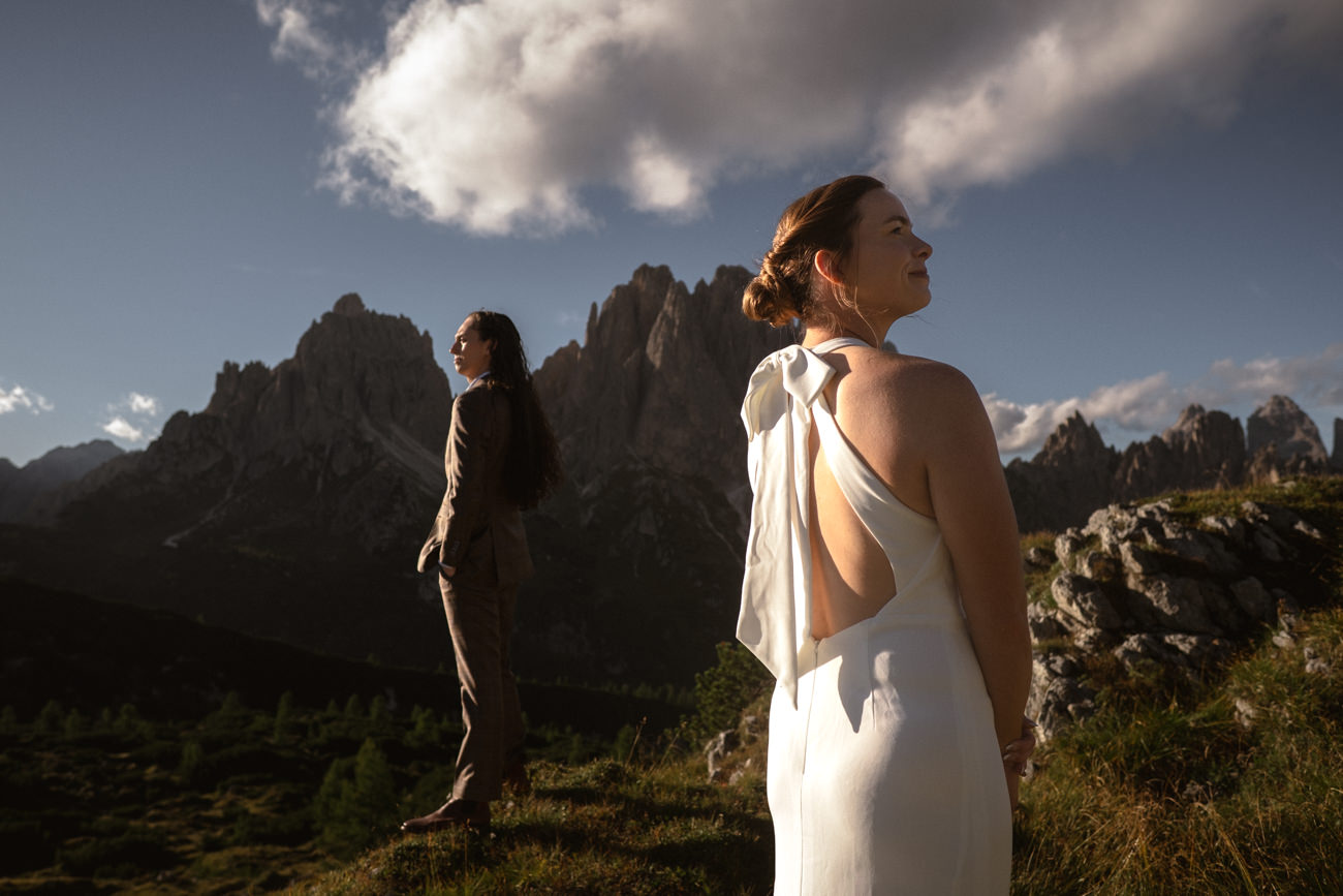 Two woman in front of a mountain at their lgbtq+ Dolomites Elopement