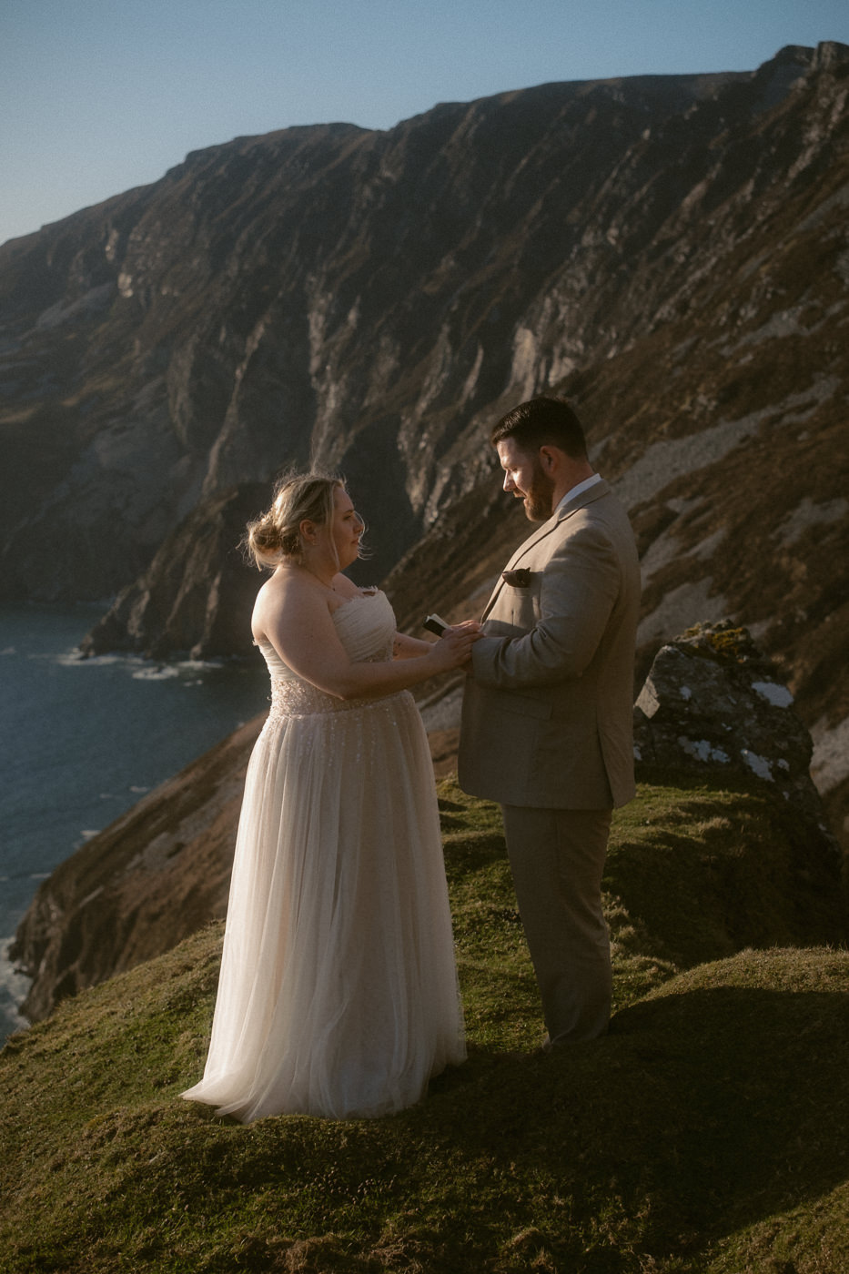 A groom and bride saying their vows during a Slieve League cliffs elopement ceremony