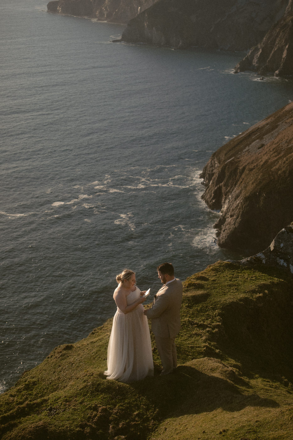 A bridal couple exchanging vows at the Slieve League Cliffs in Ireland