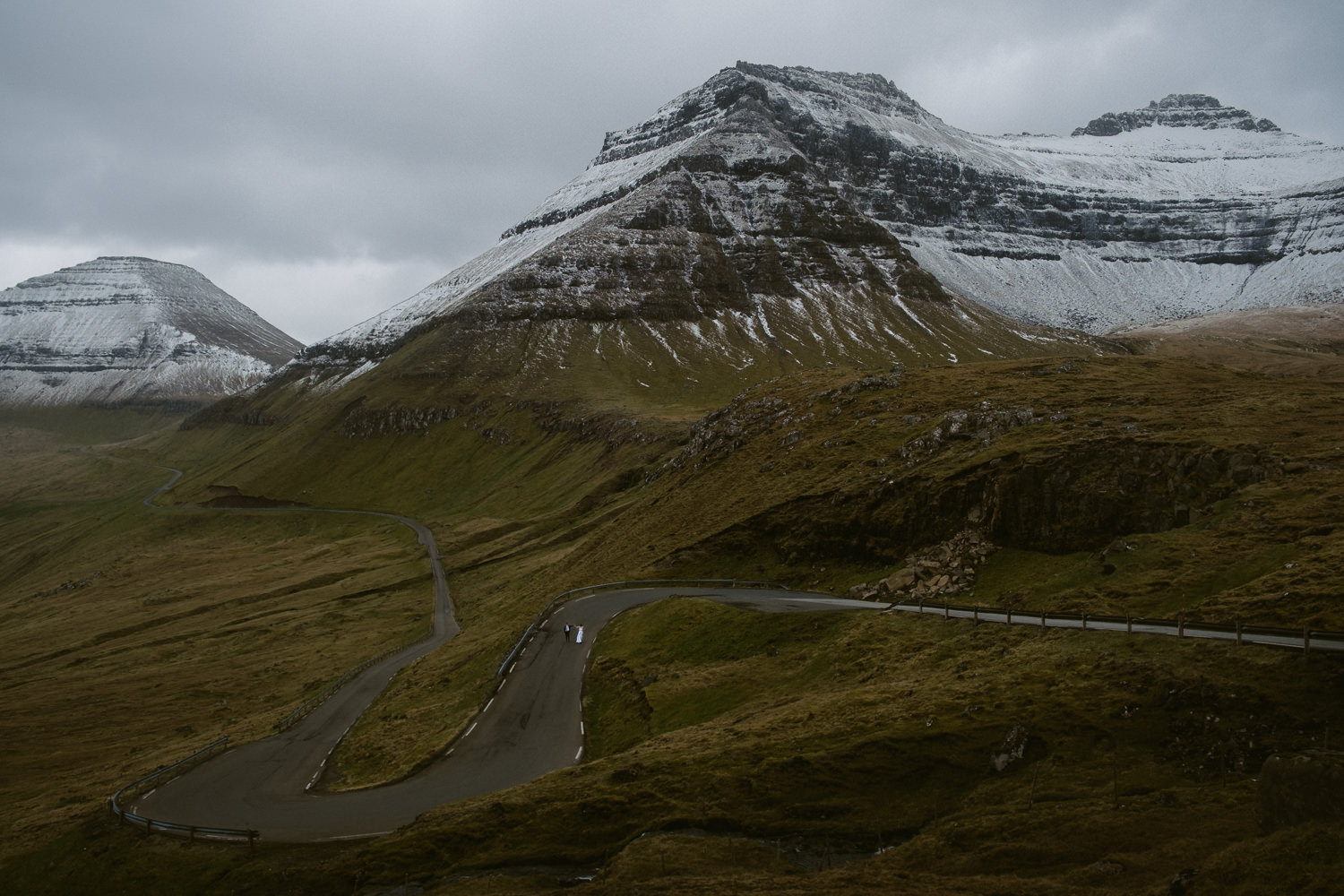 Adventurous elopement photo of a couple exploring the Faroe Islands wildest landscapes