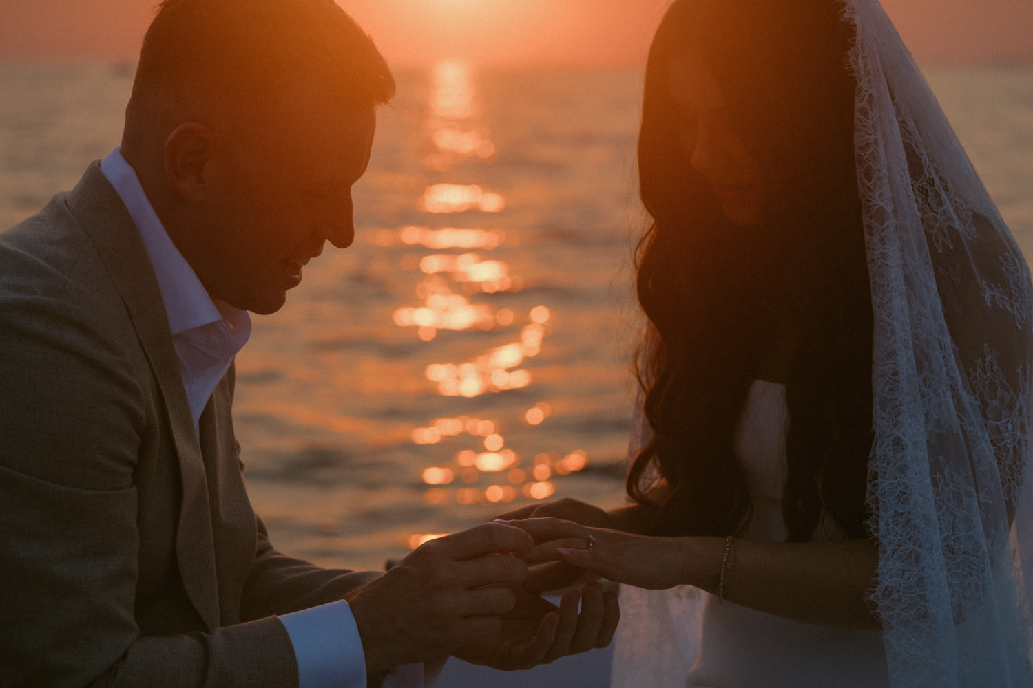 A bride and groom exchanging rings during their Amalfi Coast elopement in Sorrento